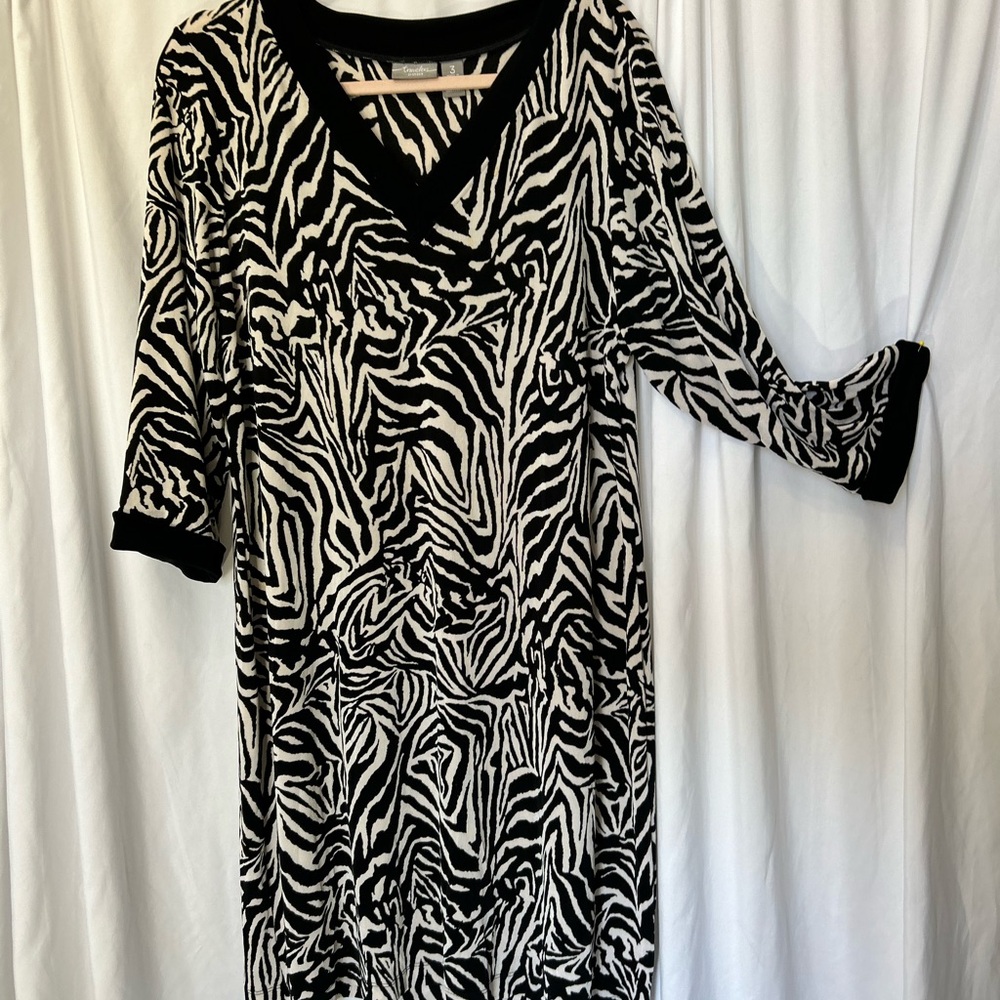 Chico’s Travelers are so great because all wrinkles shake out. Size is 3 .